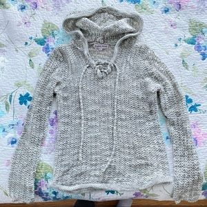 pullover over knit sweater with hood and lace up neckline gray and white